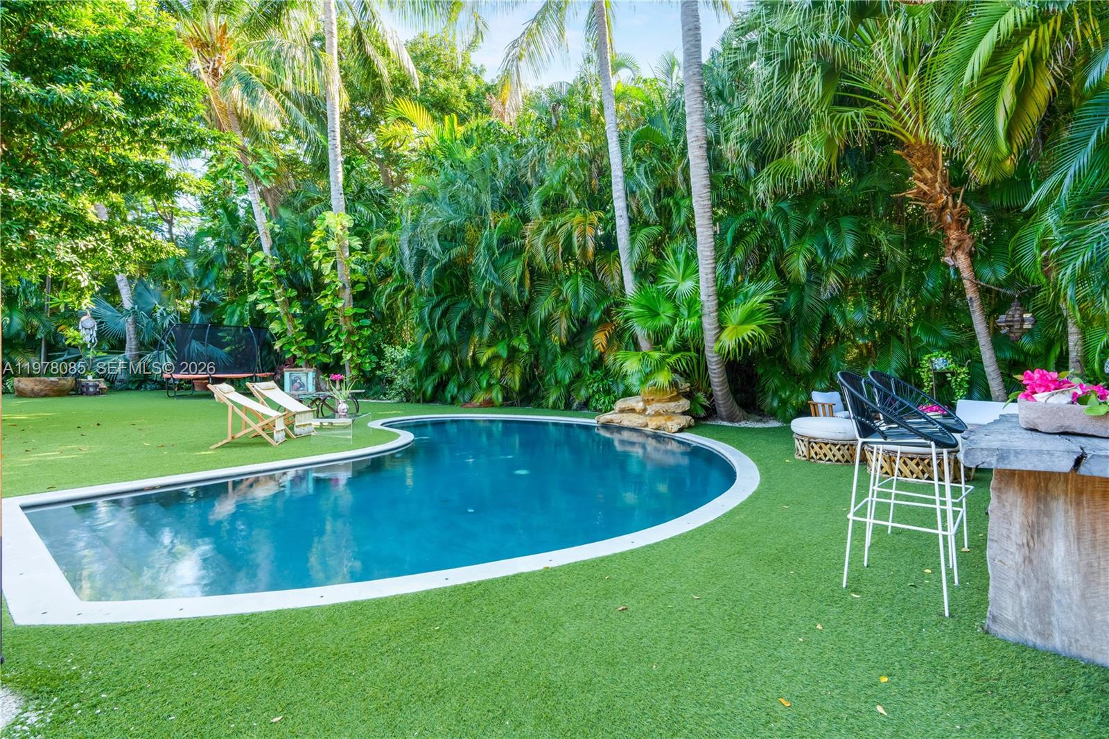 330 Gulf Road Key Biscayne, FL 33149 - Photo 39 of 46 a view of a swimming pool with a patio
