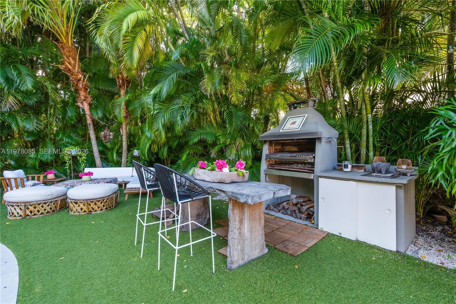 330 Gulf Road Key Biscayne, FL 33149 - Photo 40 of 46 a patio with table and chairs and potted plants