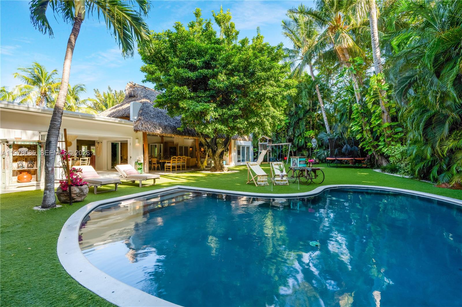 330 Gulf Road Key Biscayne, FL 33149 - Photo 42 of 46 a view of swimming pool with a garden