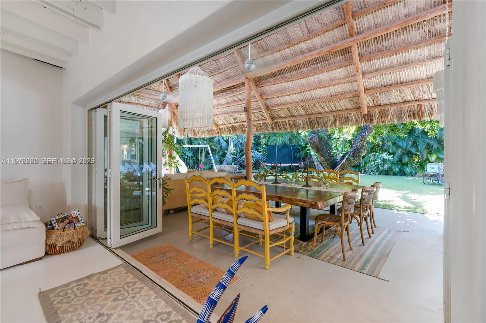 330 Gulf Road Key Biscayne, FL 33149 - Photo 10 of 46 a dining room with furniture and a floor to ceiling window
