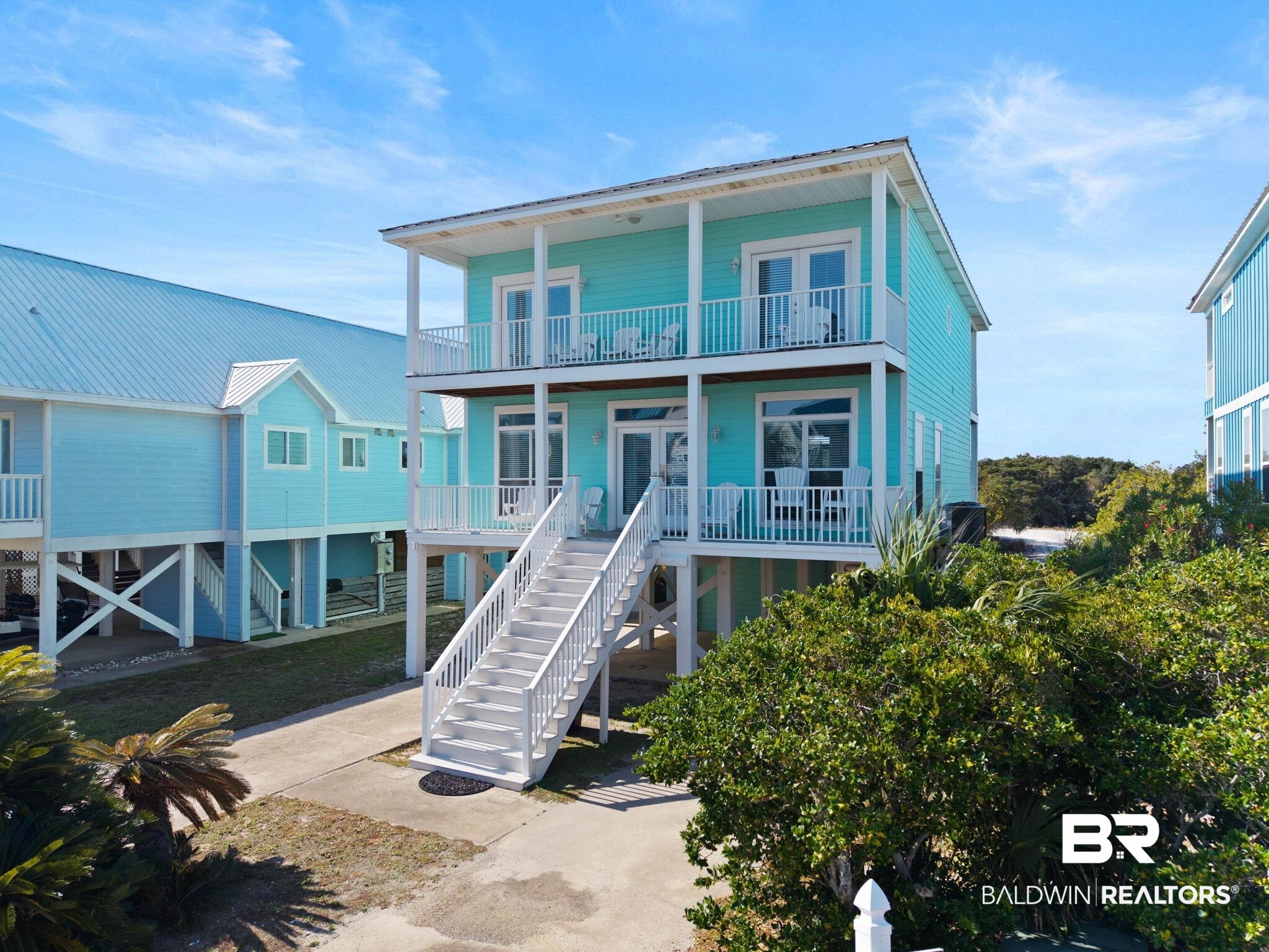 545 Plantation Road, Unit 3 Gulf Shores, AL 36542 - Photo 4 of 54 Back of property featuring french doors and stairway
