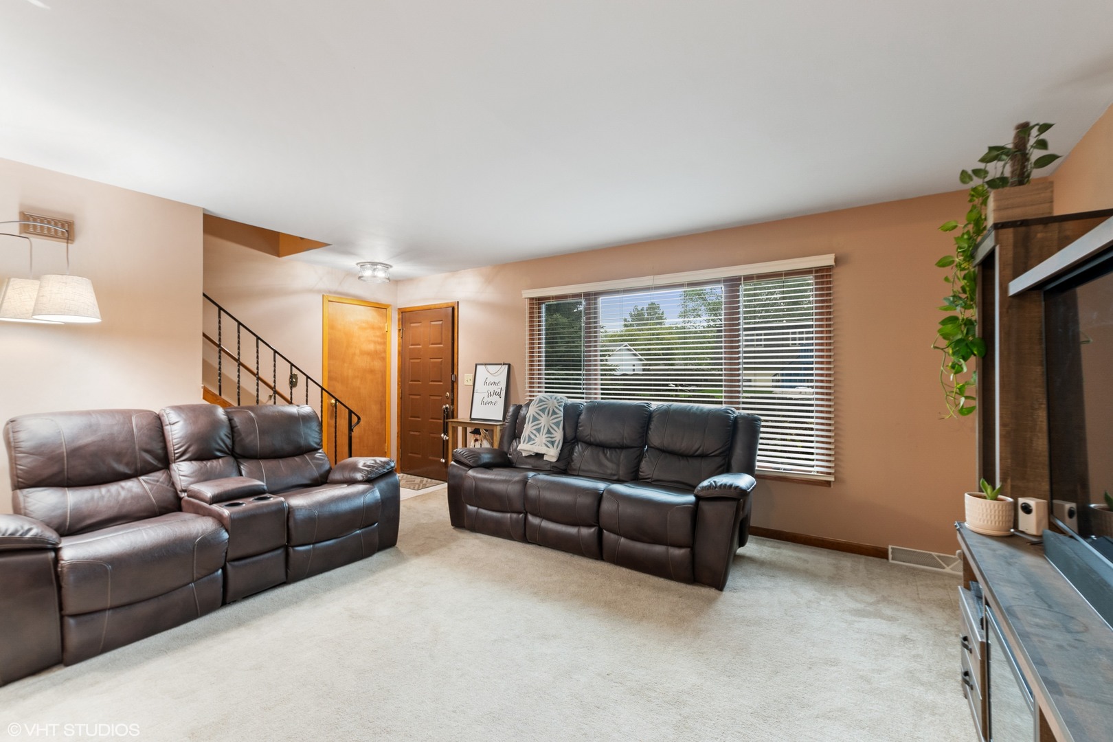 270 East Woodlawn Road, Unit 270 New Lenox, IL 60451 - Photo 2 of 14 a living room with furniture and a flat screen tv