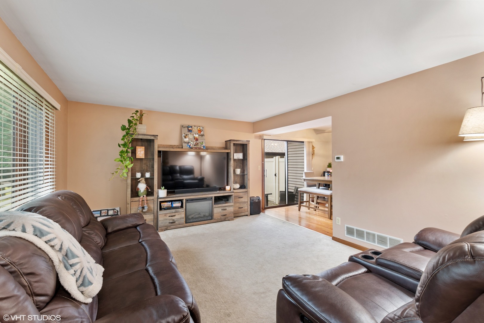 270 East Woodlawn Road, Unit 270 New Lenox, IL 60451 - Photo 3 of 14 a living room with furniture and a flat screen tv