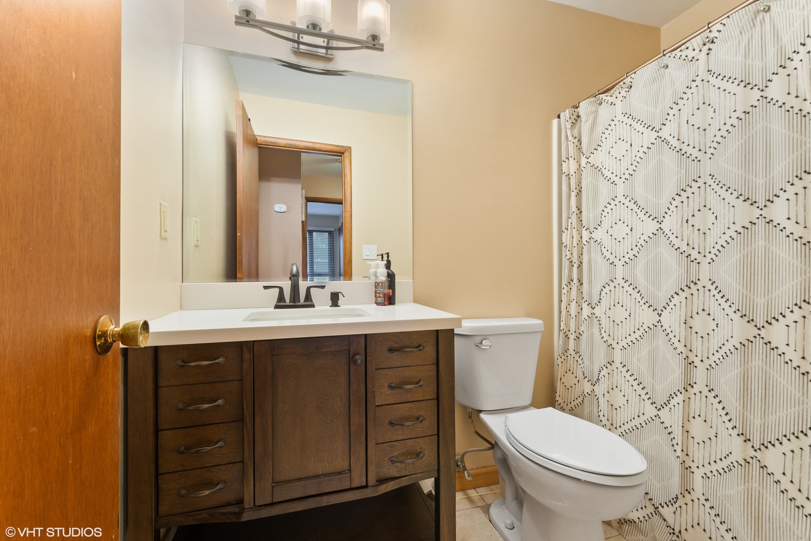 270 East Woodlawn Road, Unit 270 New Lenox, IL 60451 - Photo 9 of 14 a bathroom with a granite countertop toilet sink and mirror