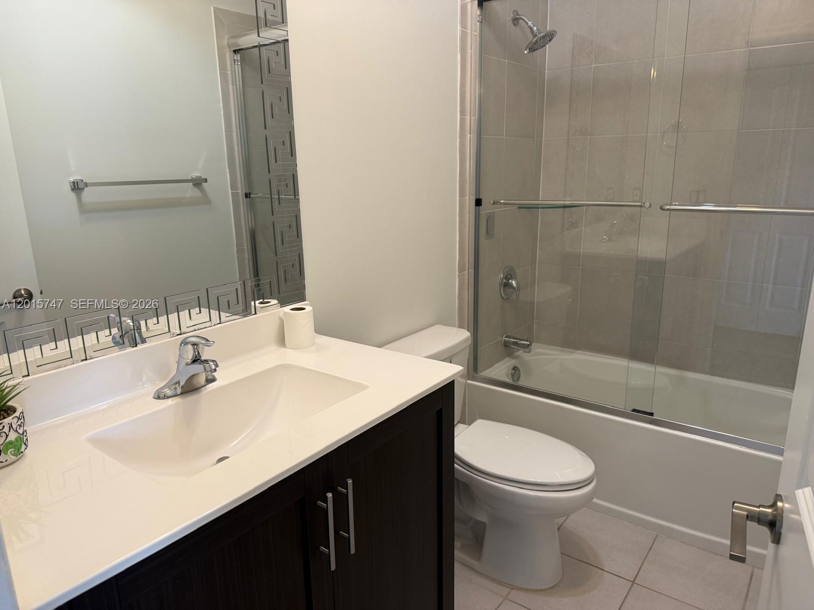 2614 Southeast 13th Street Homestead, FL 33035 - Photo 12 of 19 a bathroom with a sink a toilet and shower