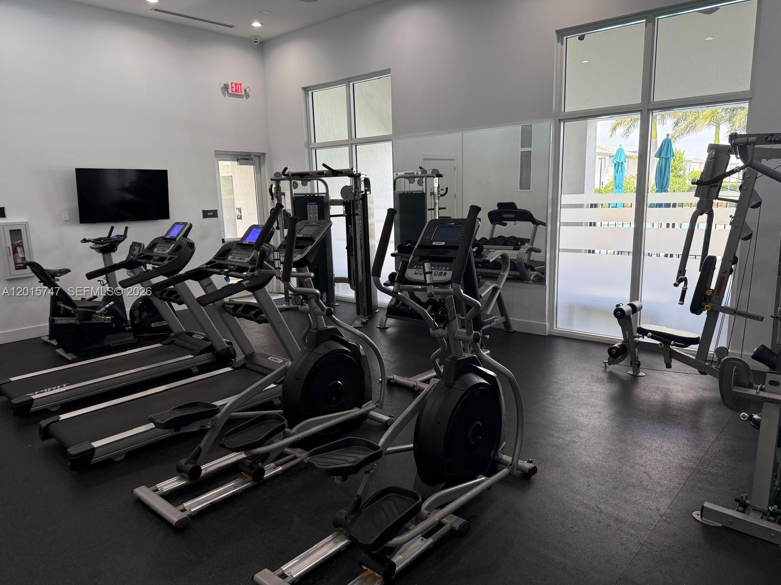 2614 Southeast 13th Street Homestead, FL 33035 - Photo 17 of 19 a view of a room with gym equipment