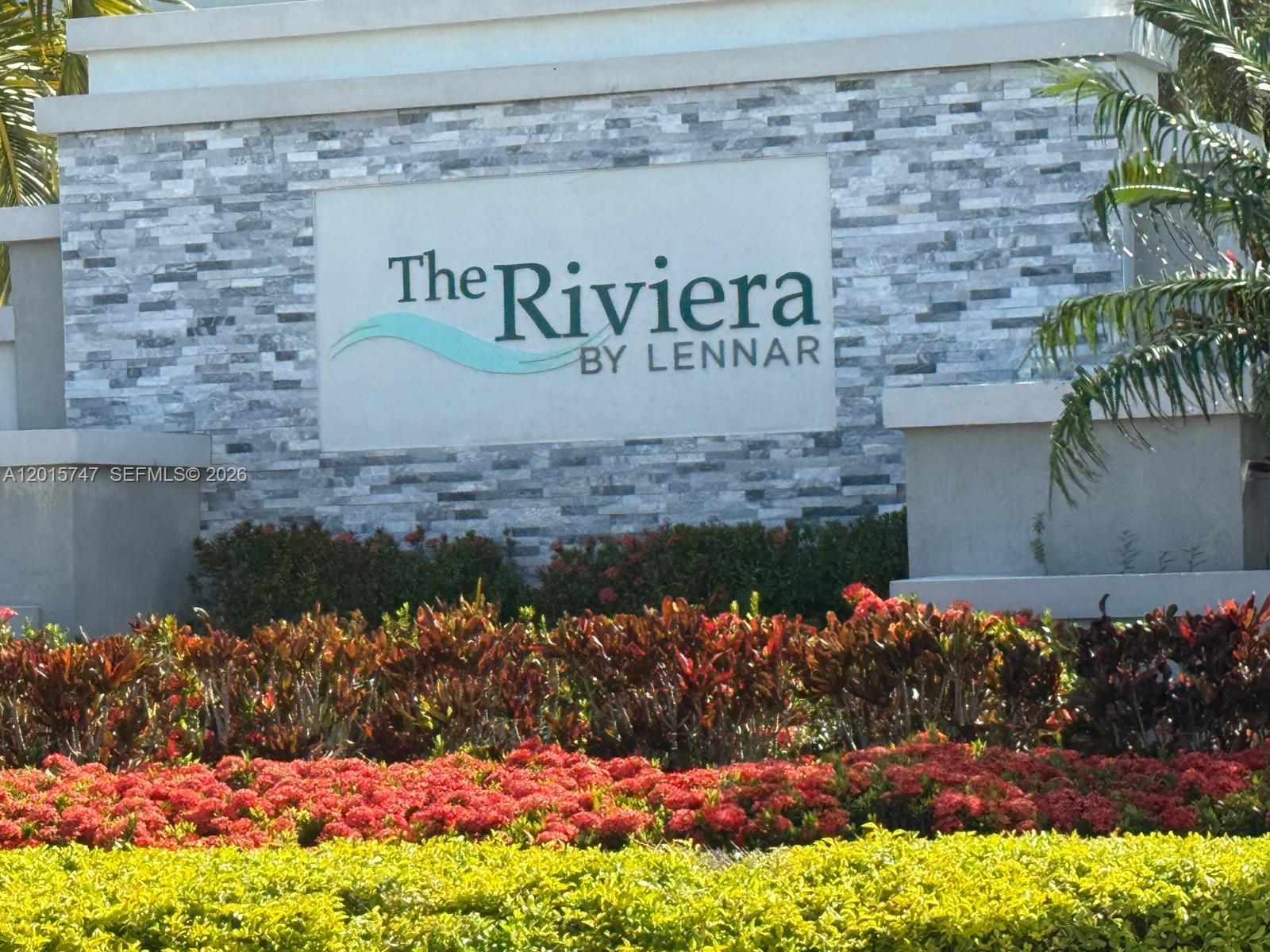 2614 Southeast 13th Street Homestead, FL 33035 - Photo 19 of 19 a street sign that is sitting in front of flowers