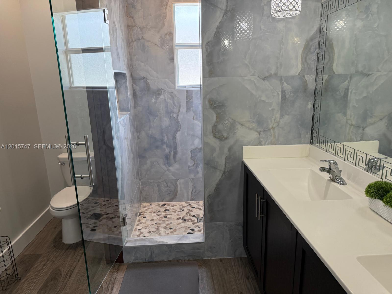 2614 Southeast 13th Street Homestead, FL 33035 - Photo 9 of 19 a bathroom with a sink and a shower