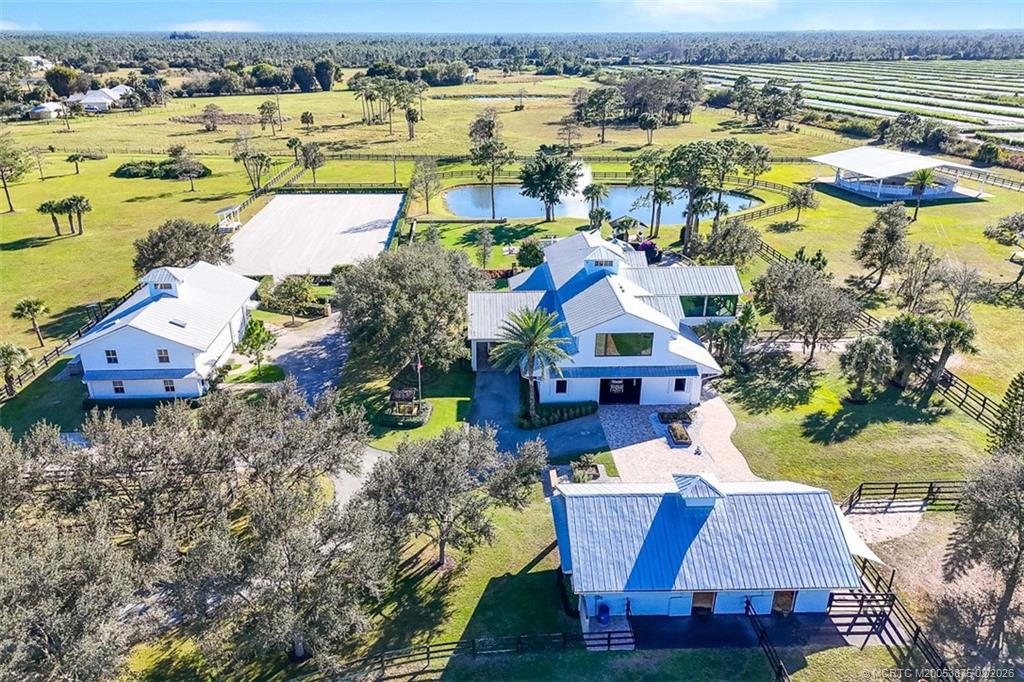 2541 Southwest Trailside Path Stuart, FL 34997 - Photo 2 of 100 an aerial view of a house with swimming pool and ocean view