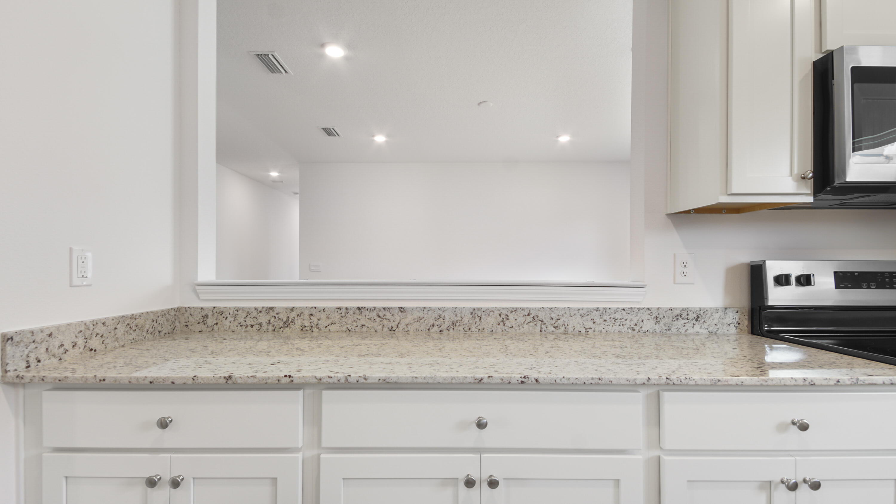 335 Bluebeech Street Freeport, FL 32439 - Photo 14 of 32 a sink with granite countertop white cabinets and a granite counter top