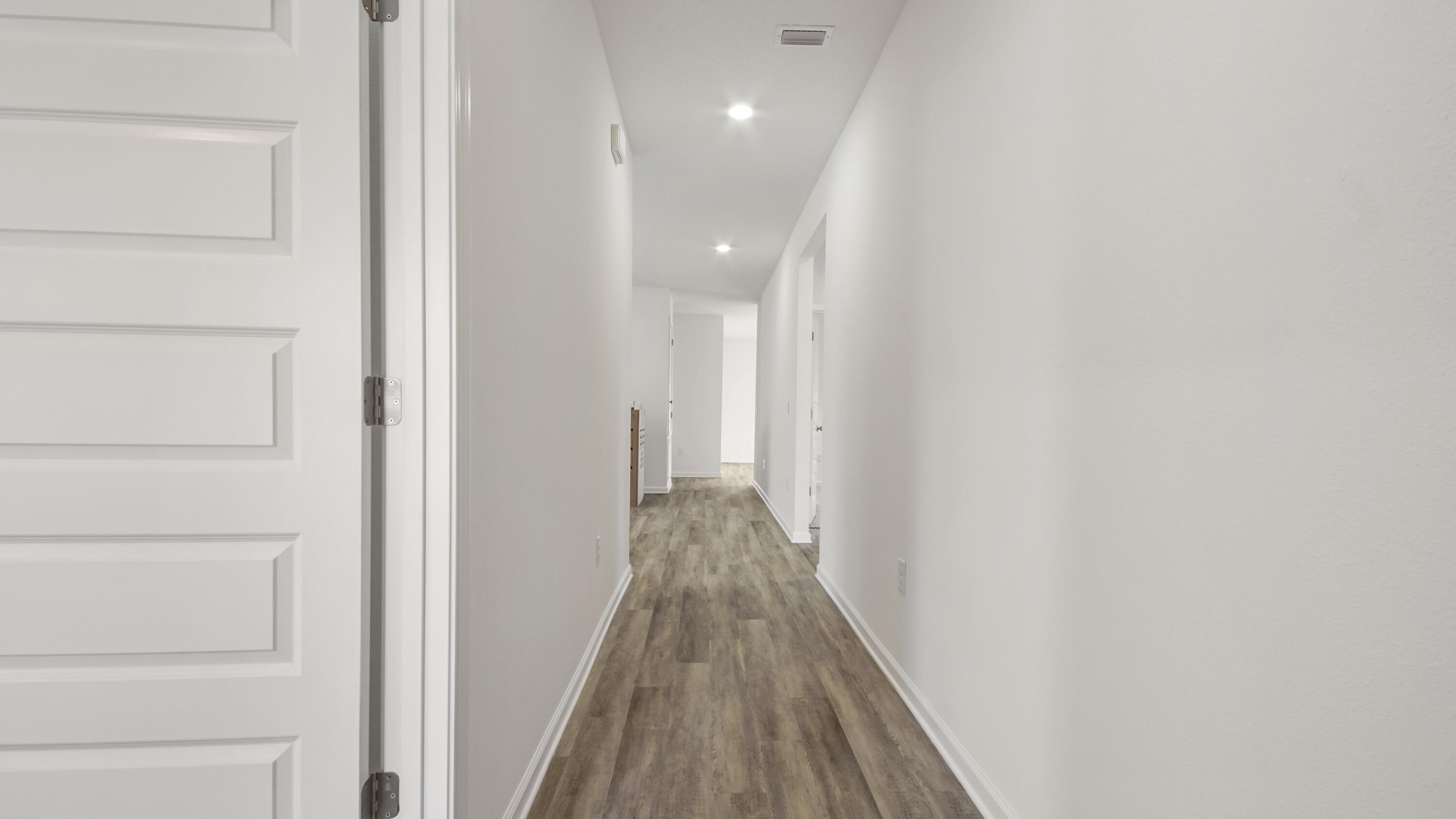 335 Bluebeech Street Freeport, FL 32439 - Photo 3 of 32 a view of a hallway with wooden floor