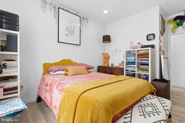 a bedroom with a bed and a closet
