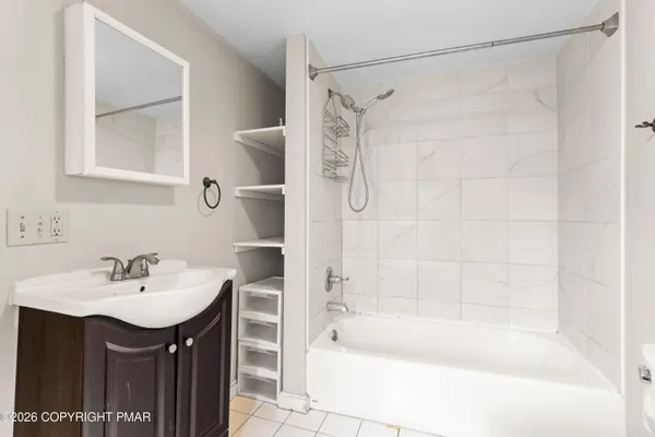 a bathroom with a sink and a bathtub