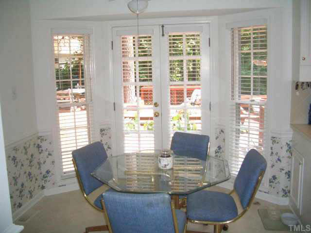 2721 Salisbury Raleigh, NC 27613 - Photo 4 of 10 a view of a dining room with furniture and wooden floor
