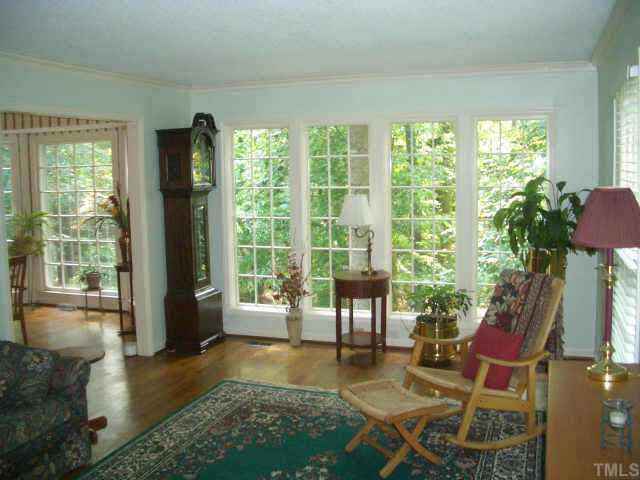 2721 Salisbury Raleigh, NC 27613 - Photo 5 of 10 a living room with furniture and a floor to ceiling window