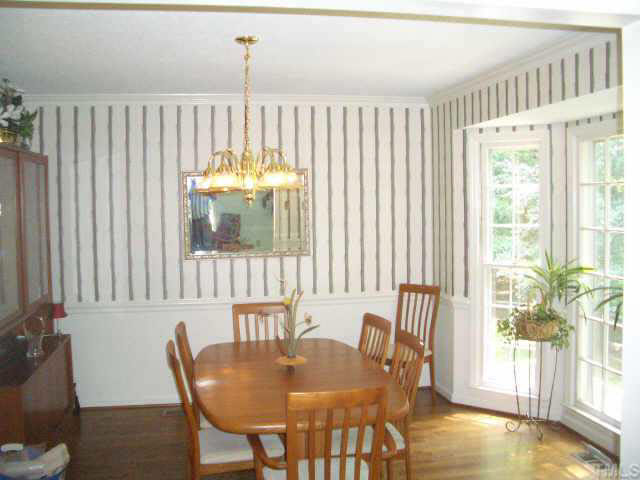 2721 Salisbury Raleigh, NC 27613 - Photo 7 of 10 a view of a dining room with furniture and a window