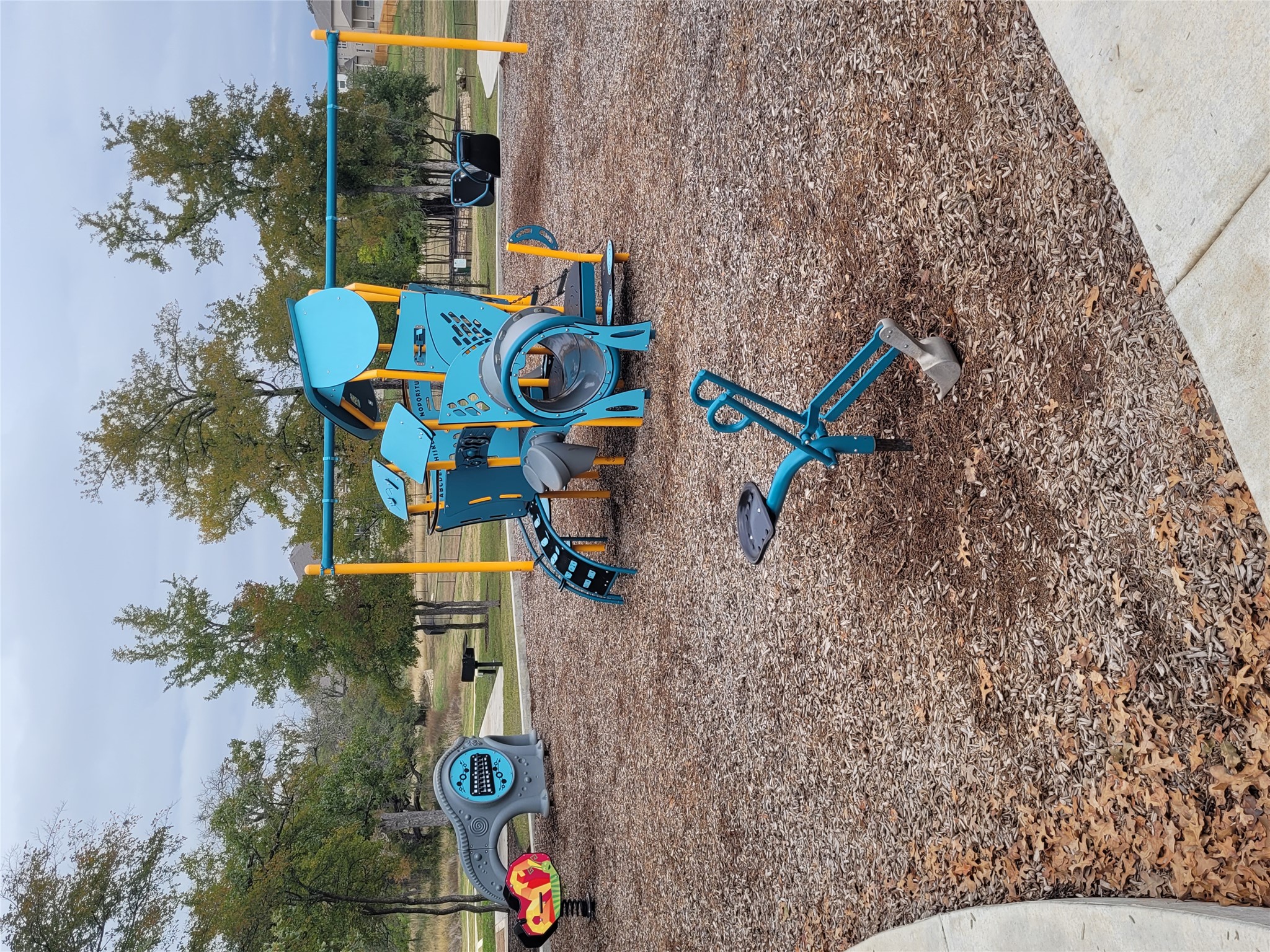 120 Free Stone Drive Georgetown, TX 78628 - Photo 35 of 40 A vibrant playground structure invites active outdoor fun amidst a tranquil, treed setting.