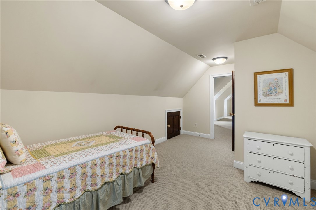 13173 Scotchtown Road Beaverdam, VA 23015 - Photo 47 of 65 a bedroom with a bed and a dresser