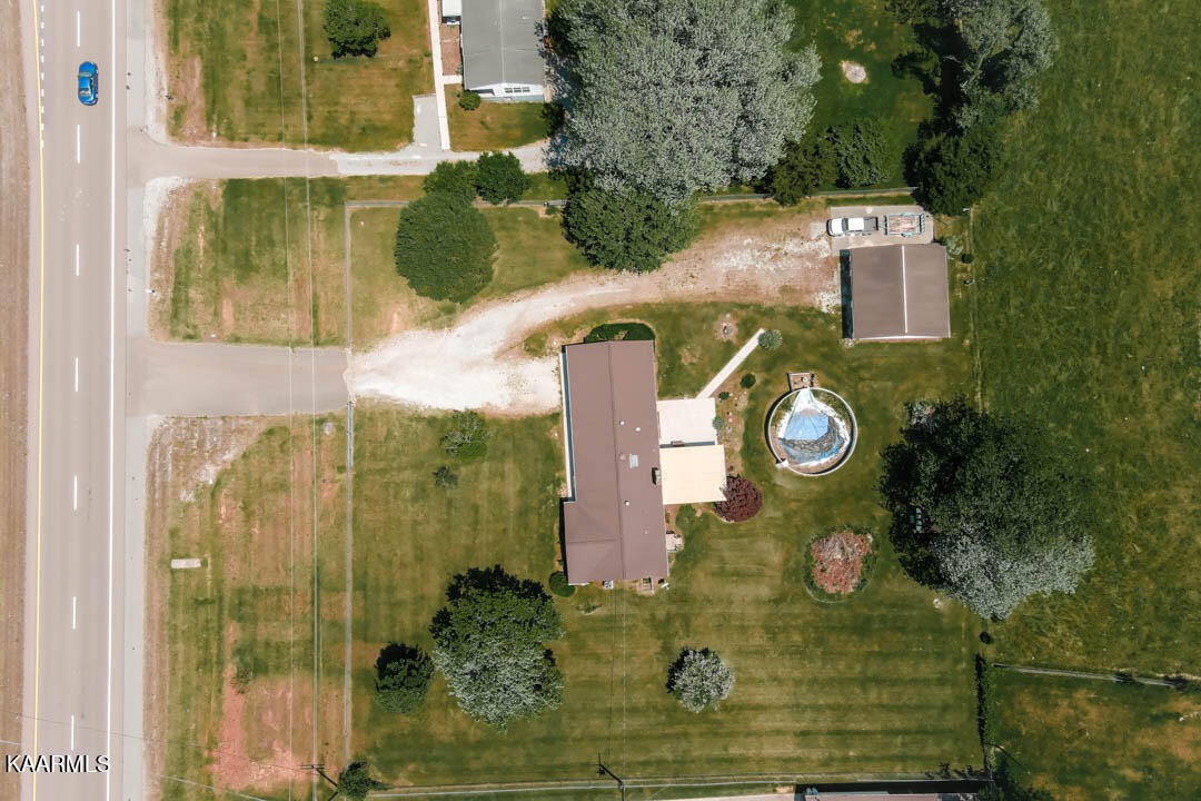 10008 Rutledge Pike Corryton, TN 37721 - Photo 29 of 30 a aerial view of a house with a yard and large trees all around