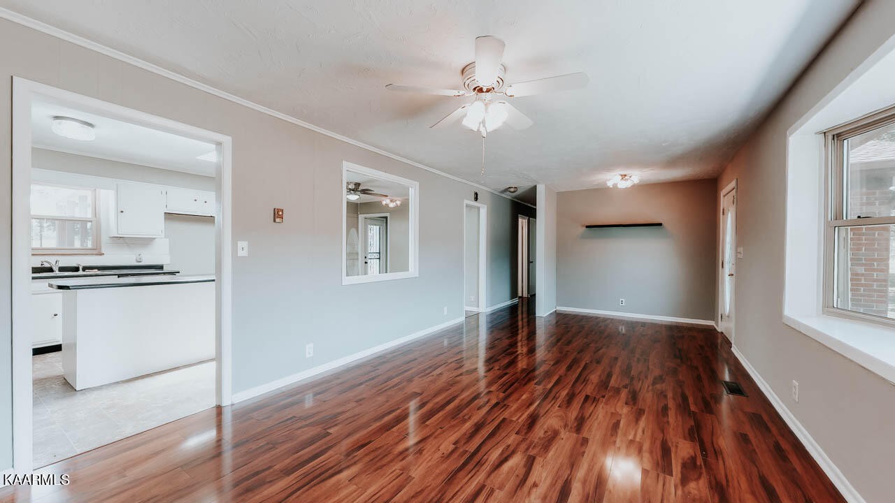 10008 Rutledge Pike Corryton, TN 37721 - Photo 5 of 30 a view of kitchen with ceiling fan and wooden floor