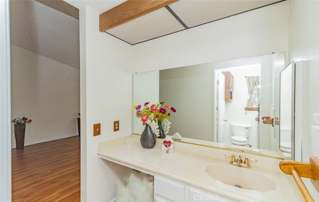 1182 North Sunflower Avenue Covina, CA 91724 - Photo 12 of 20 a bathroom with a sink and a mirror