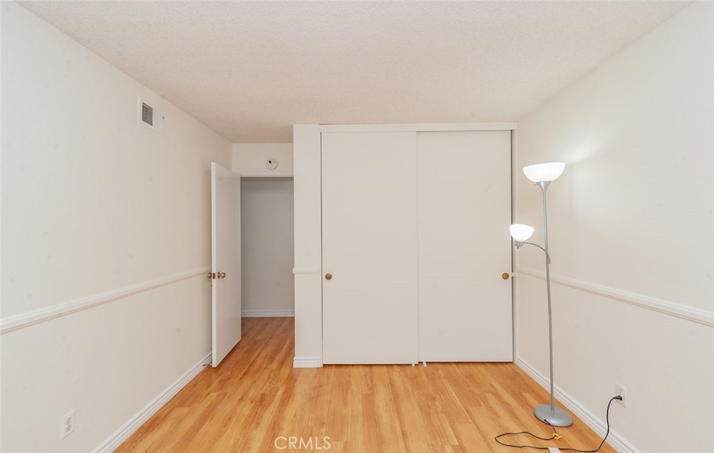 1182 North Sunflower Avenue Covina, CA 91724 - Photo 14 of 20 a view of a room with wooden floor and a bathroom