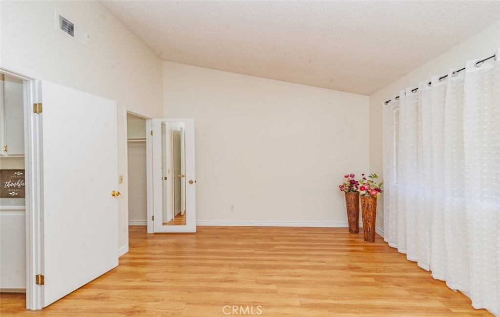 1182 North Sunflower Avenue Covina, CA 91724 - Photo 16 of 20 a view of a room with wooden floor