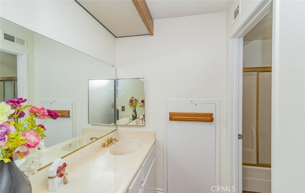 1182 North Sunflower Avenue Covina, CA 91724 - Photo 17 of 20 a bathroom with a sink and a mirror