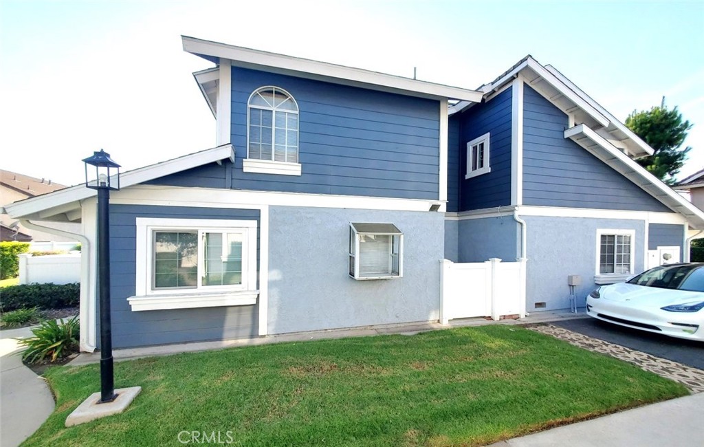 1182 North Sunflower Avenue Covina, CA 91724 - Photo 19 of 20 a front view of a house with a garden