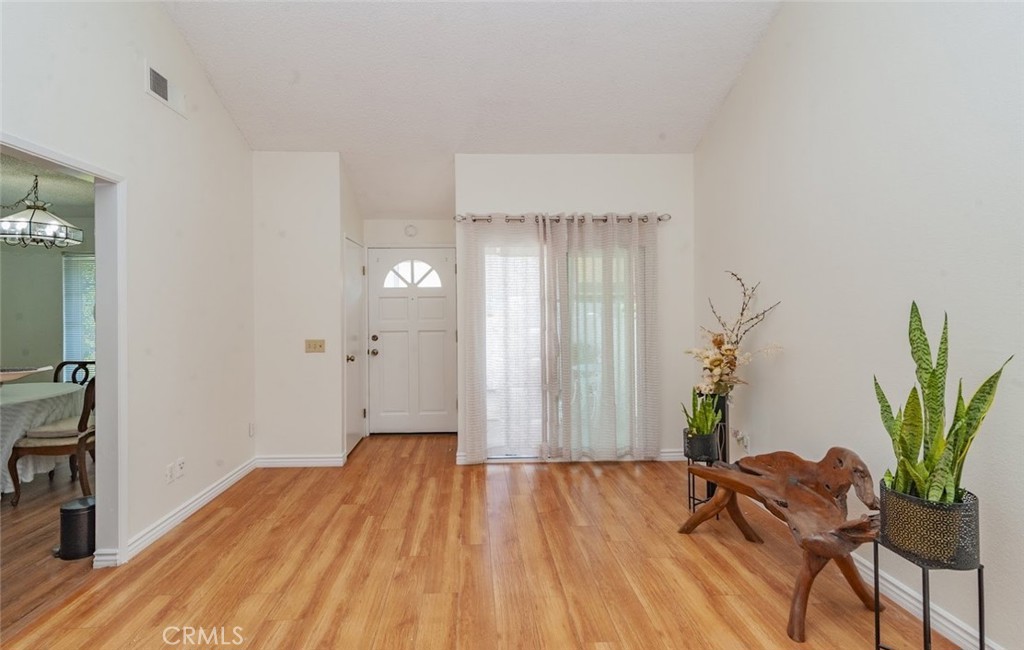 1182 North Sunflower Avenue Covina, CA 91724 - Photo 4 of 20 a view of a room with wooden floor and plant