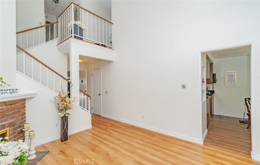 1182 North Sunflower Avenue Covina, CA 91724 - Photo 7 of 20 a view of entryway and hall with wooden floor