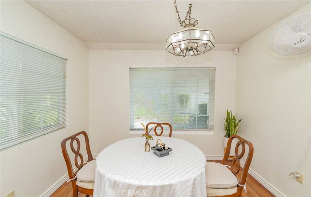 1182 North Sunflower Avenue Covina, CA 91724 - Photo 10 of 20 a view of a dining room with furniture wooden floor and a chandelier