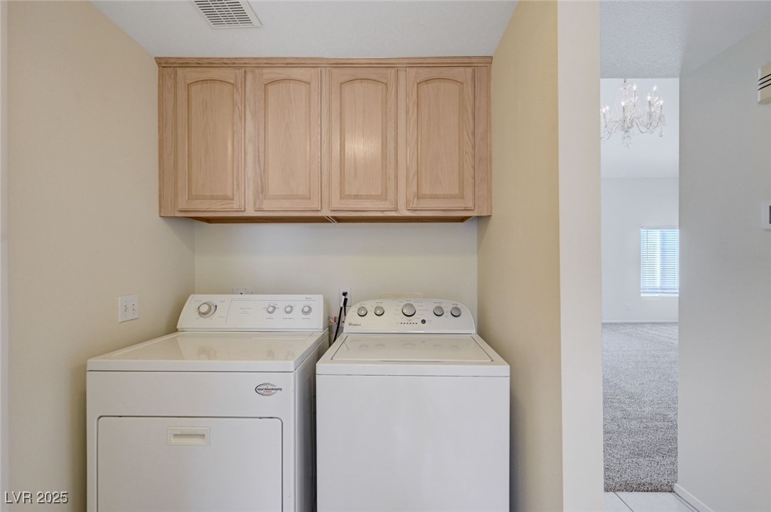 3213 Shallow Point Circle Las Vegas, NV 89117 - Photo 16 of 43 Laundry room with access to garage, kitchen and 1/2 bath
