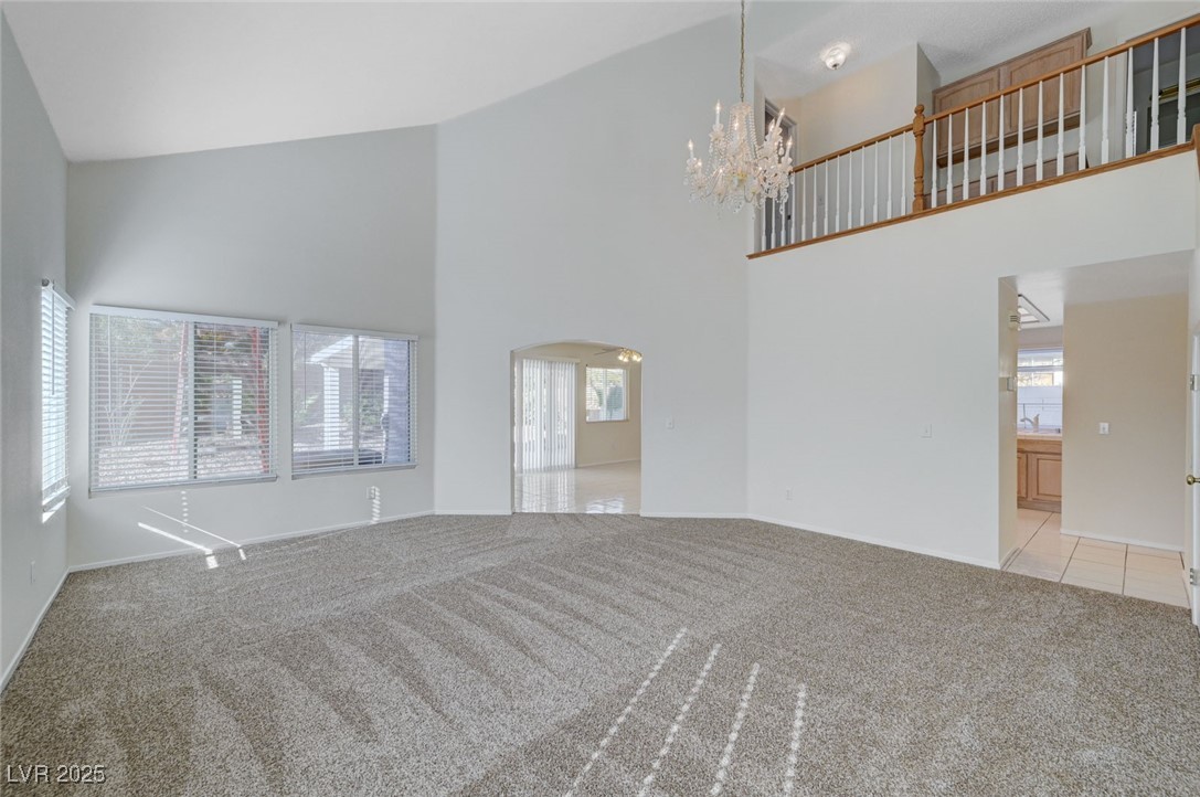 3213 Shallow Point Circle Las Vegas, NV 89117 - Photo 4 of 43 Enter into the living room with vaulted high ceilings