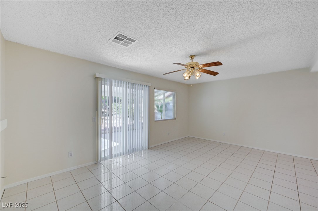 3213 Shallow Point Circle Las Vegas, NV 89117 - Photo 7 of 43 Here is the family room with access to backyard.