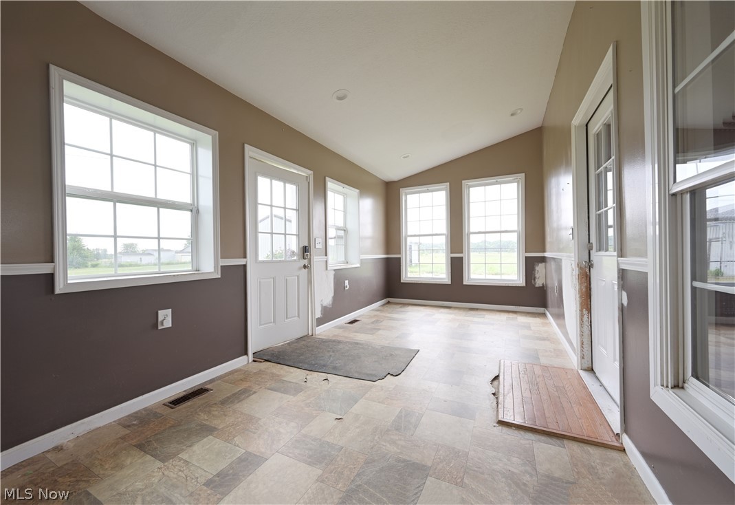 19105 Whitehead Road Lagrange, OH 44050 - Photo 25 of 37 Entryway with lofted ceiling and light tile patterned floors