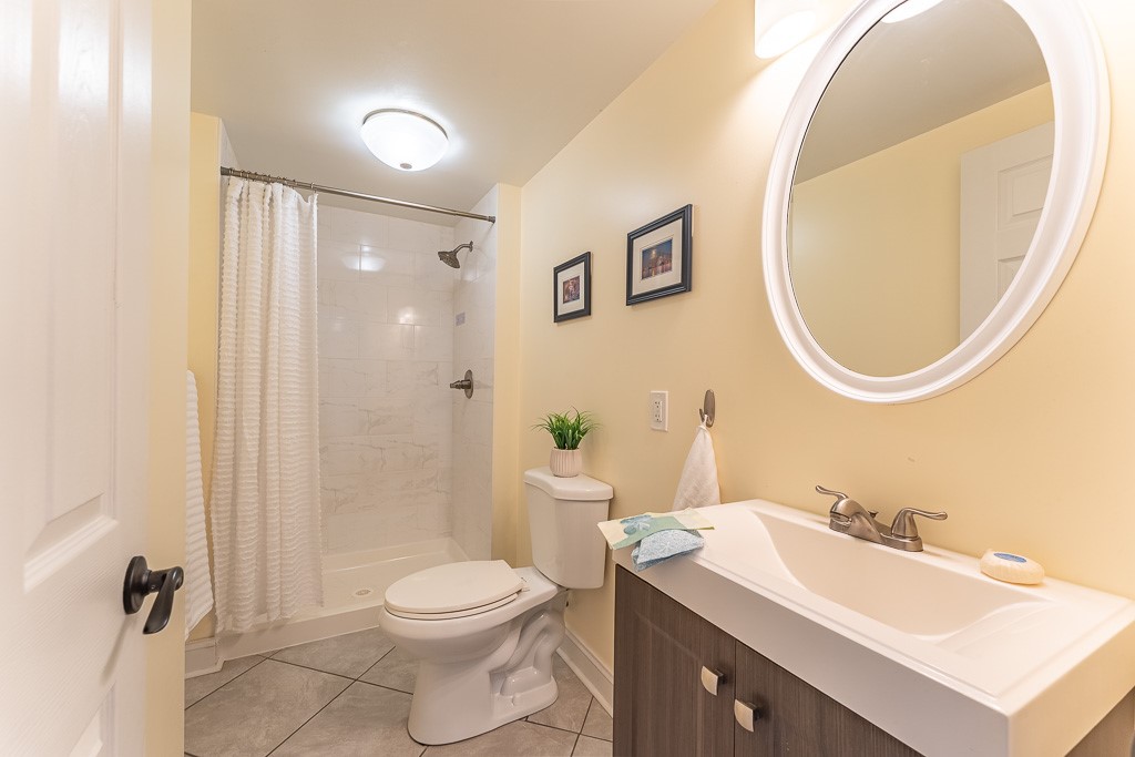 220 Hibiscus Drive Rochester, NY 14618 - Photo 29 of 50 It's paired with a full bath with tiled shower.