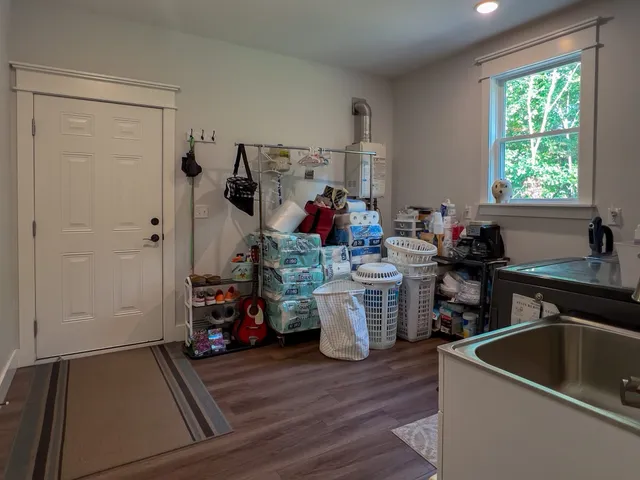 a kitchen filled a sink dishwasher and a refrigerator