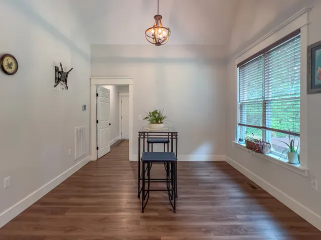 a view of a livingroom with furniture and wooden floor