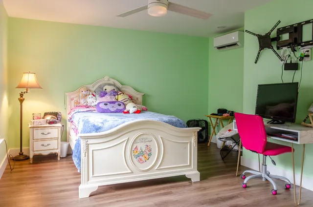 a view of backyard with swimming pool and outdoor seating