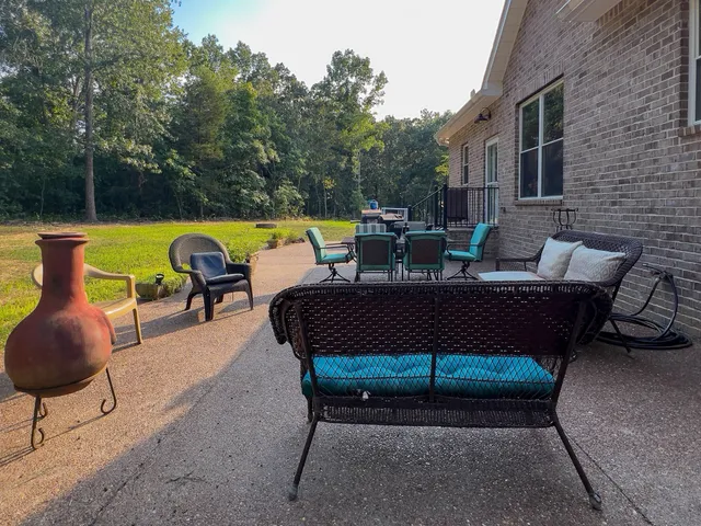 a view of a couches in backyard of house