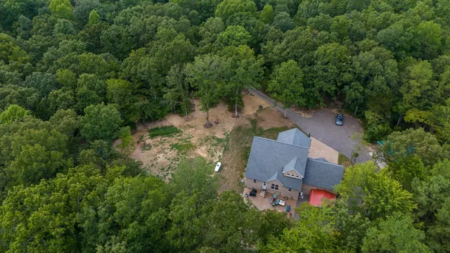 a sign on the side of the river