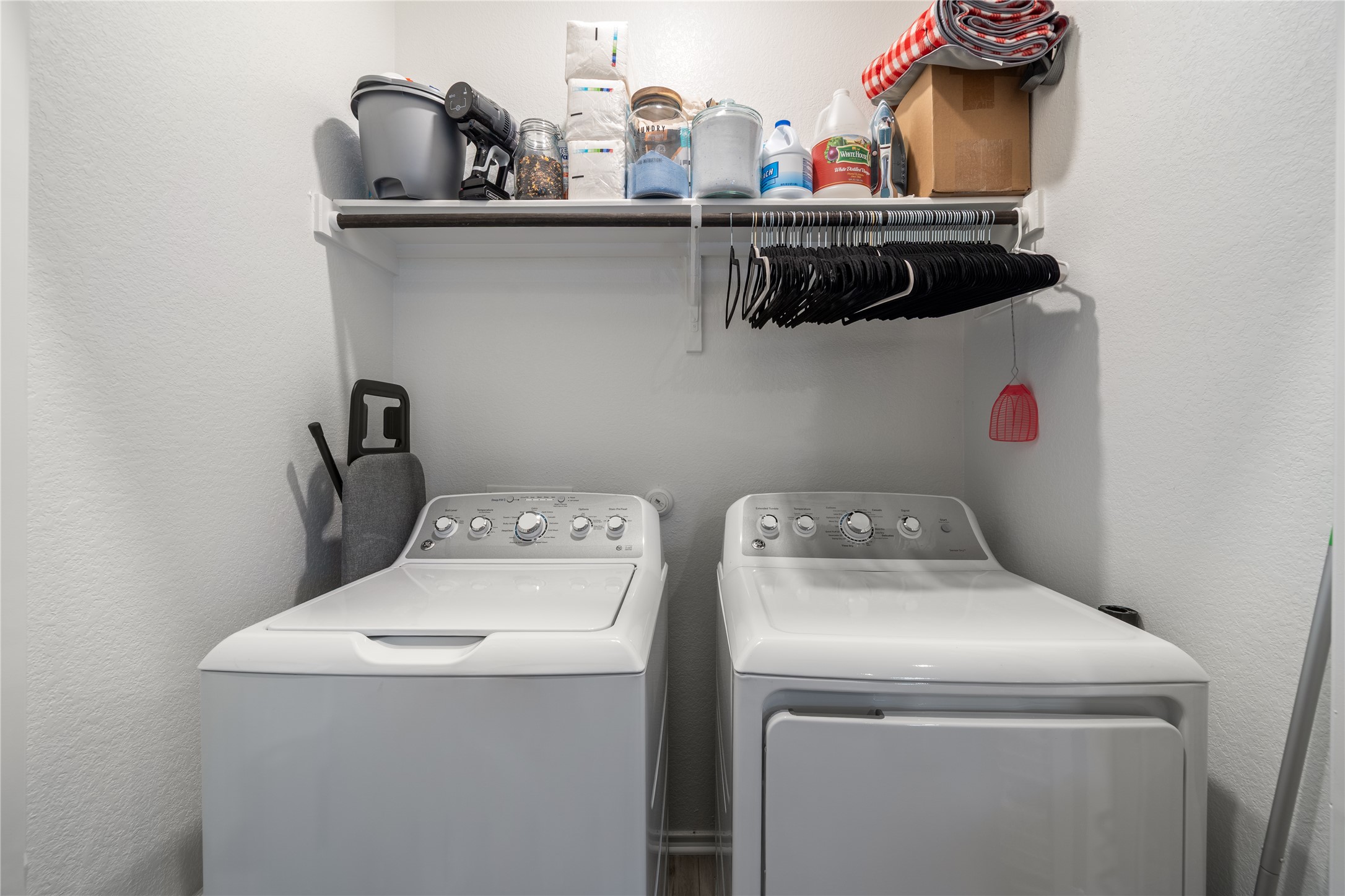 14404 Berning Road Manor, TX 78653 - Photo 23 of 38 A dedicated laundry space provides practical, built-in shelving for efficient organization.
