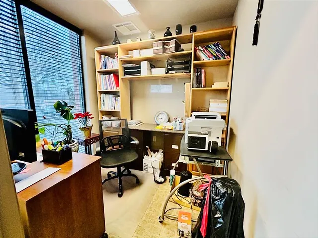 a view of a workspace with furniture