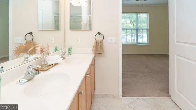 a bathroom with a sink vanity and a mirror