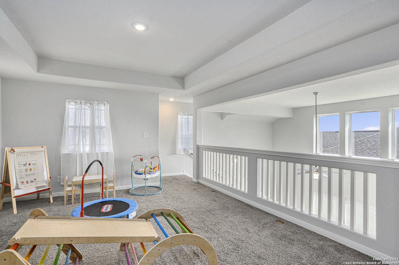 16615 Ginger Crossing Elmendorf, TX 78112 - Photo 16 of 31 a living room with furniture a flat screen tv and a table