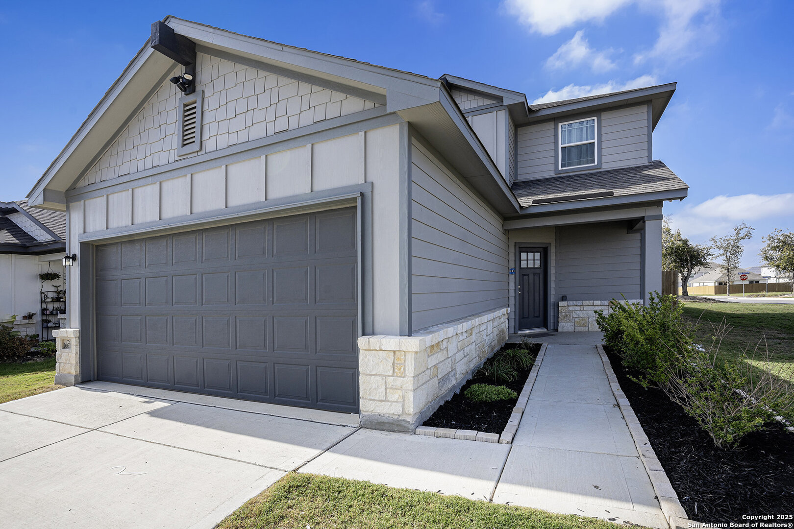 16615 Ginger Crossing Elmendorf, TX 78112 - Photo 2 of 31 a front view of a house with garage