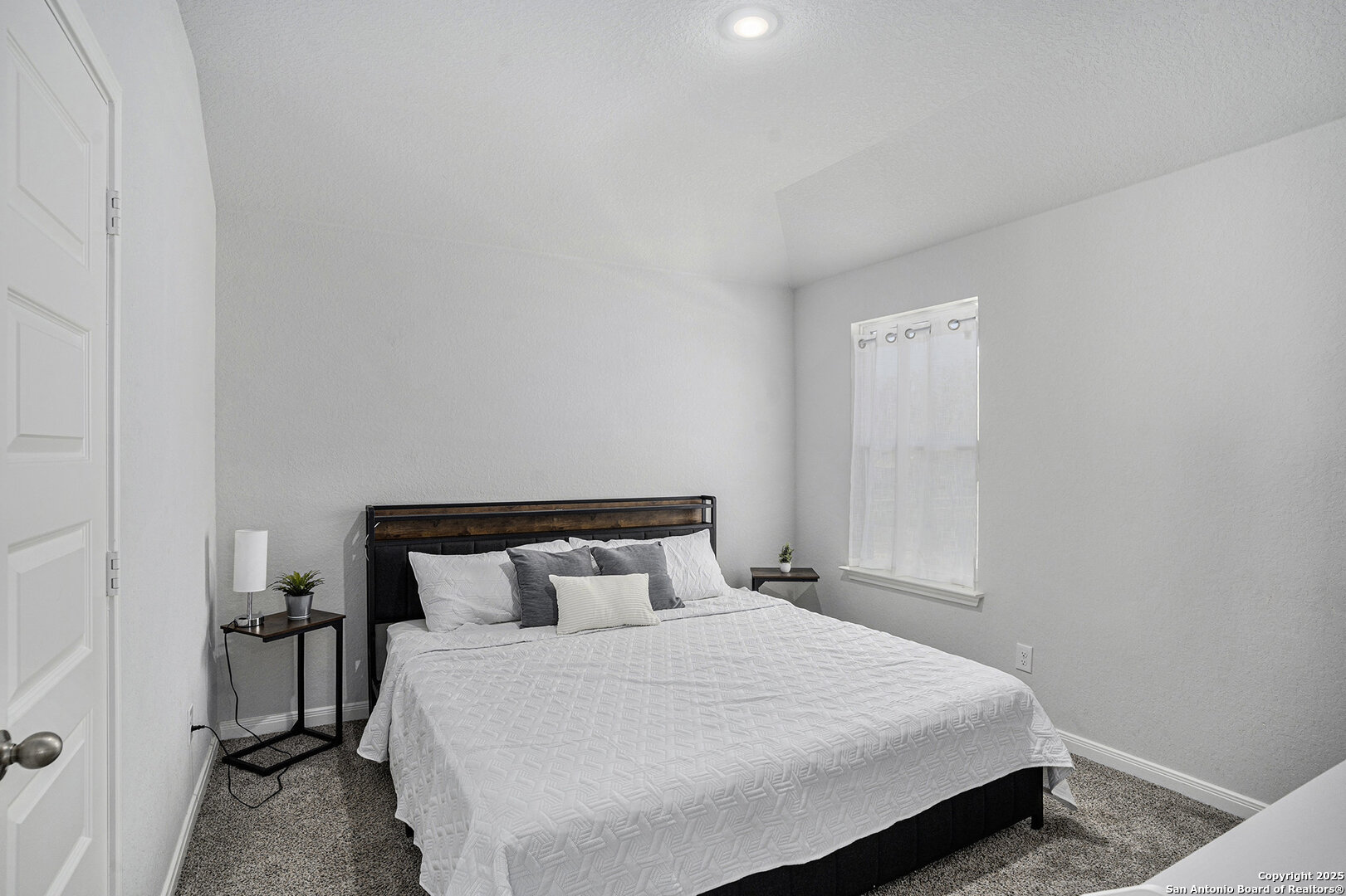 16615 Ginger Crossing Elmendorf, TX 78112 - Photo 22 of 31 a bedroom with a bed and a night stand