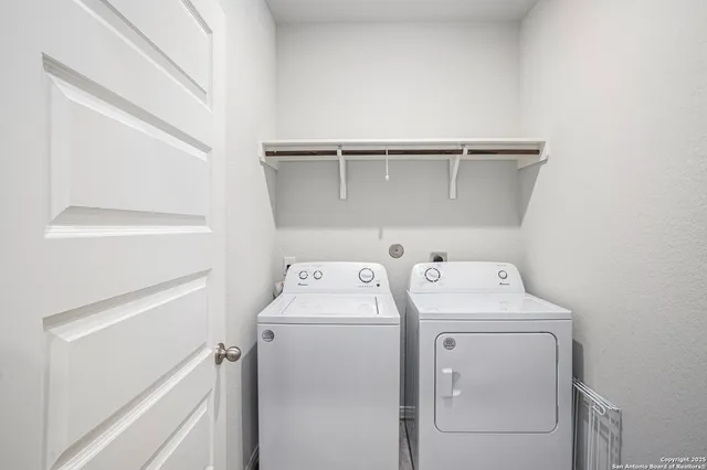 a living room with furniture a rug and a large window