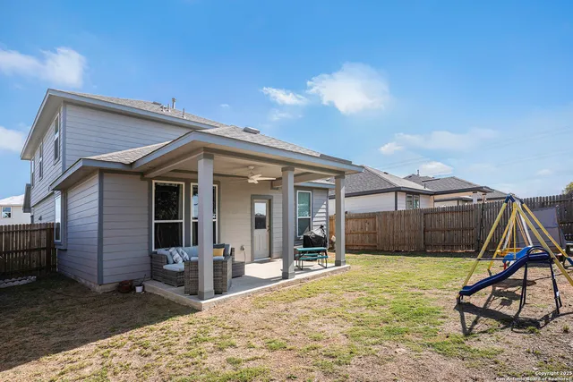 a view of house with yard and seating space